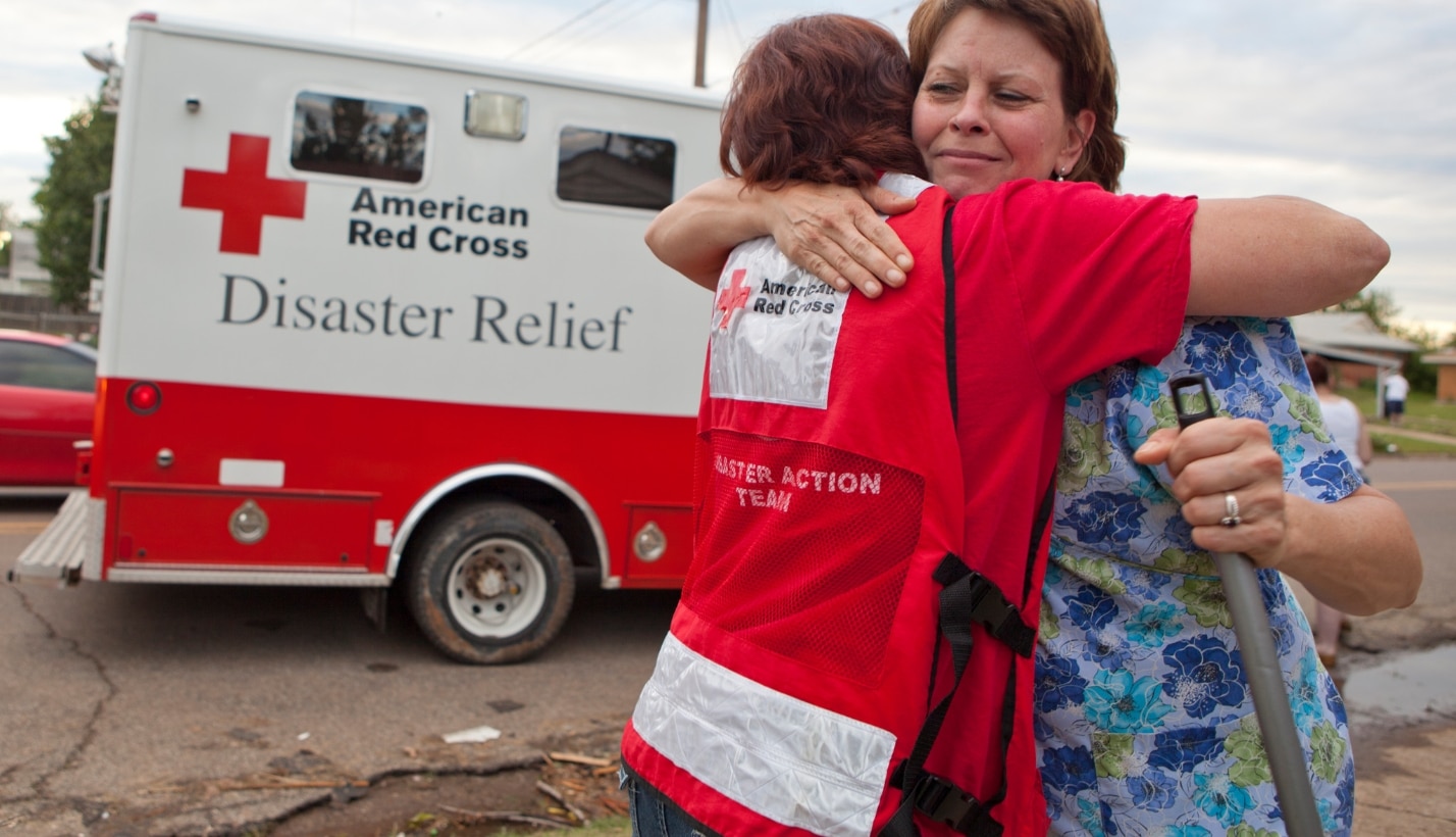 volunteer-hugs-woman-tornado
